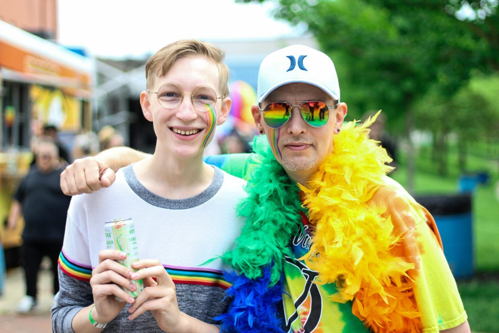 Two men are posing for a picture at an event.